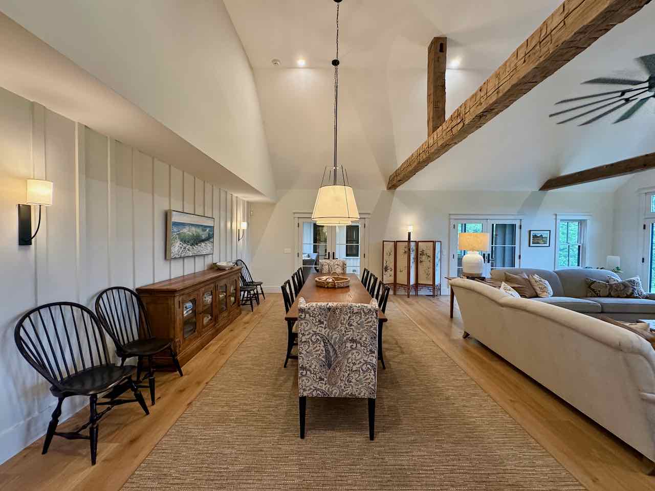 60 Meetinghouse Road Chilmark, MA 02535 - Photo 19 of 49 a living room with furniture and a chandelier