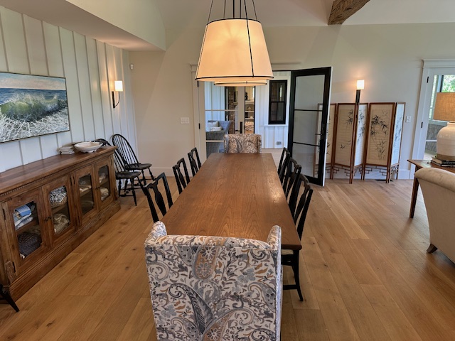 60 Meetinghouse Road Chilmark, MA 02535 - Photo 20 of 49 a dining room with wooden floor and windows