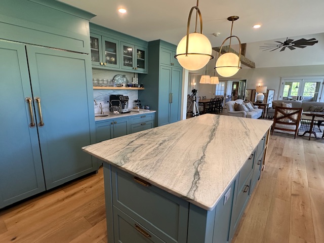 60 Meetinghouse Road Chilmark, MA 02535 - Photo 22 of 49 a large kitchen with stainless steel appliances a large counter top space a refrigerator and chandelier