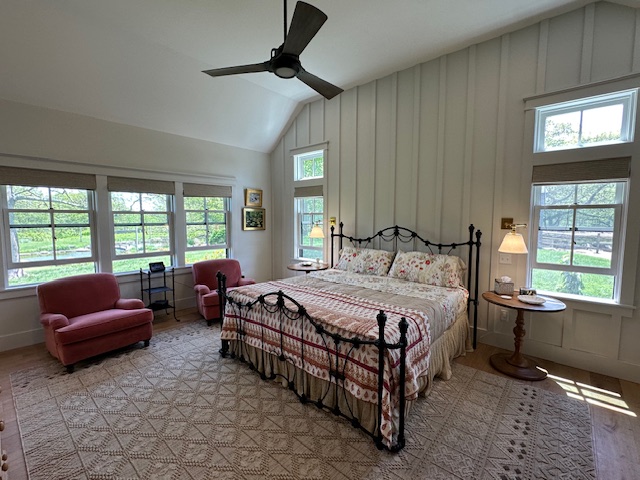 60 Meetinghouse Road Chilmark, MA 02535 - Photo 31 of 49 a bedroom with a bed couch and a large window