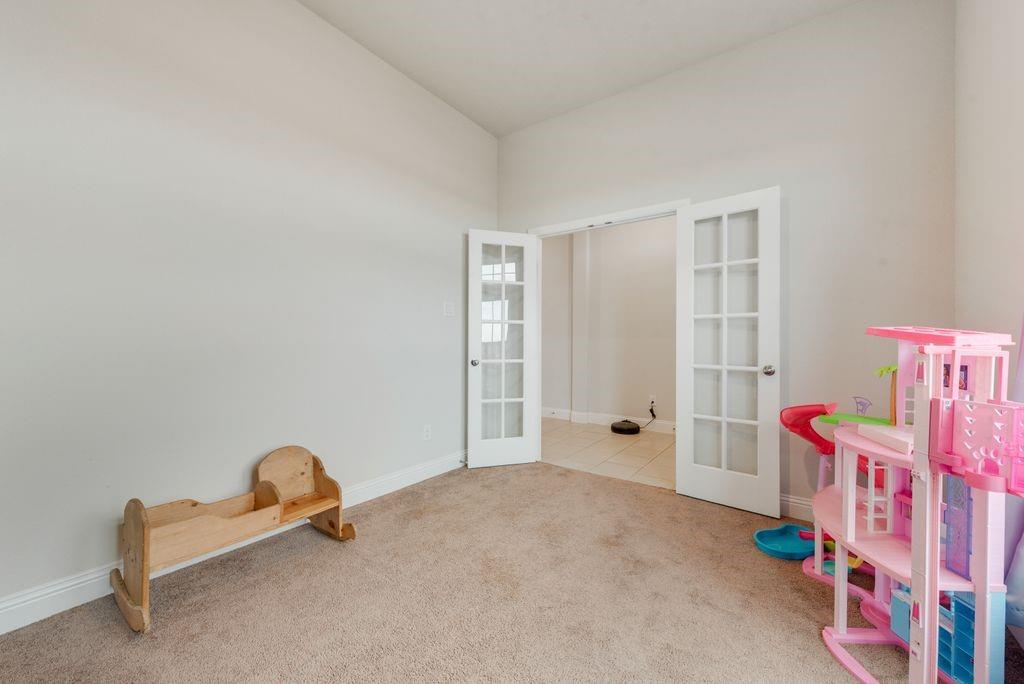 1202 Holly Street Cleburne, TX 76033 - Photo 17 of 36 a room with toys and a table