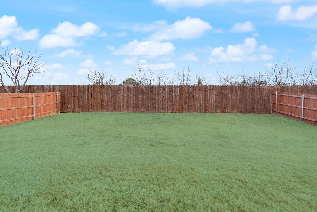 1202 Holly Street Cleburne, TX 76033 - Photo 34 of 36 a view of a backyard