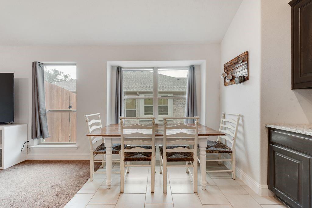 1202 Holly Street Cleburne, TX 76033 - Photo 10 of 36 a dining room with furniture and window