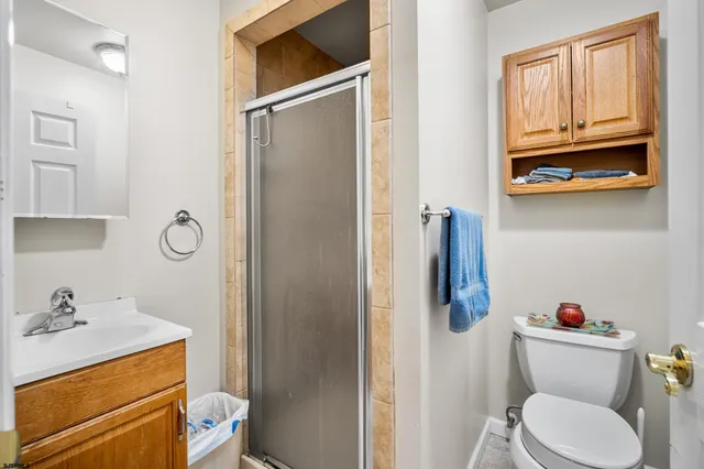 a bathroom with a sink a vanity and a shower curtain