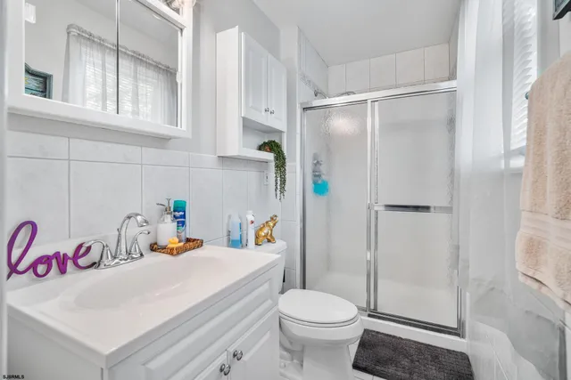 a view of a deck with table and chairs and wooden floor