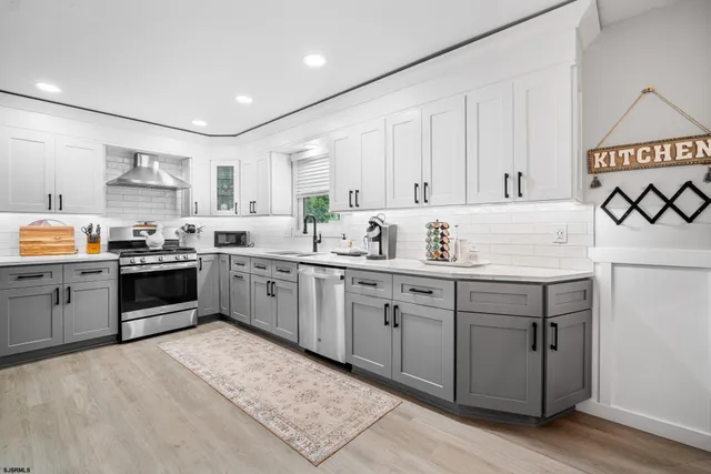 a view of a dining room with furniture a chandelier and wooden floor