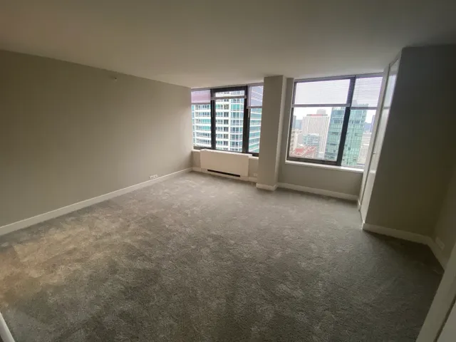 an empty room with a fireplace