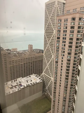 a view of a terrace with couches and a table and chairs