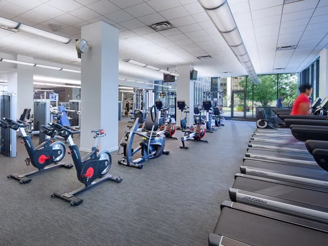 a room with pool table games and windows