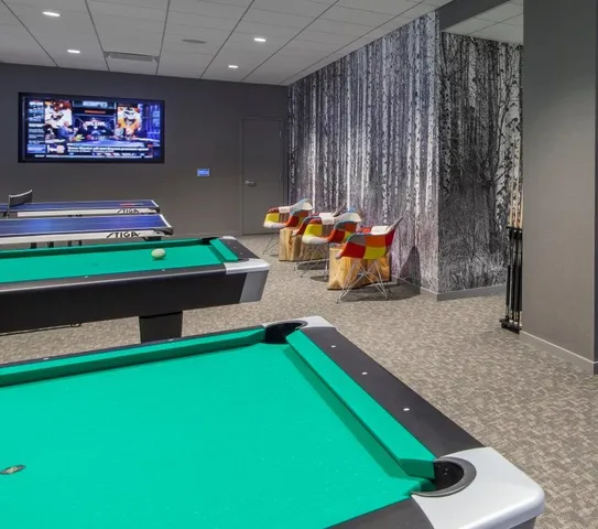 a living room filled with furniture and a chandelier