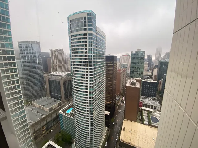 a view of a city with tall buildings