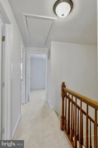 an empty room with a empty space and a ceiling fan