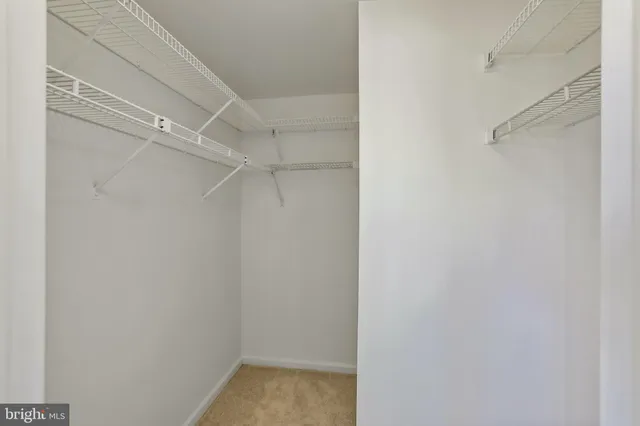 a bathroom with a sink toilet and a mirror