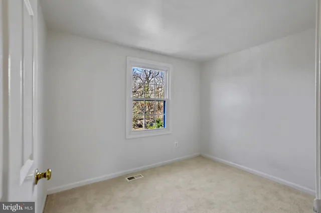a bathroom with a sink vanity granite and toilet