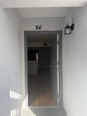 a view of an empty room with a window