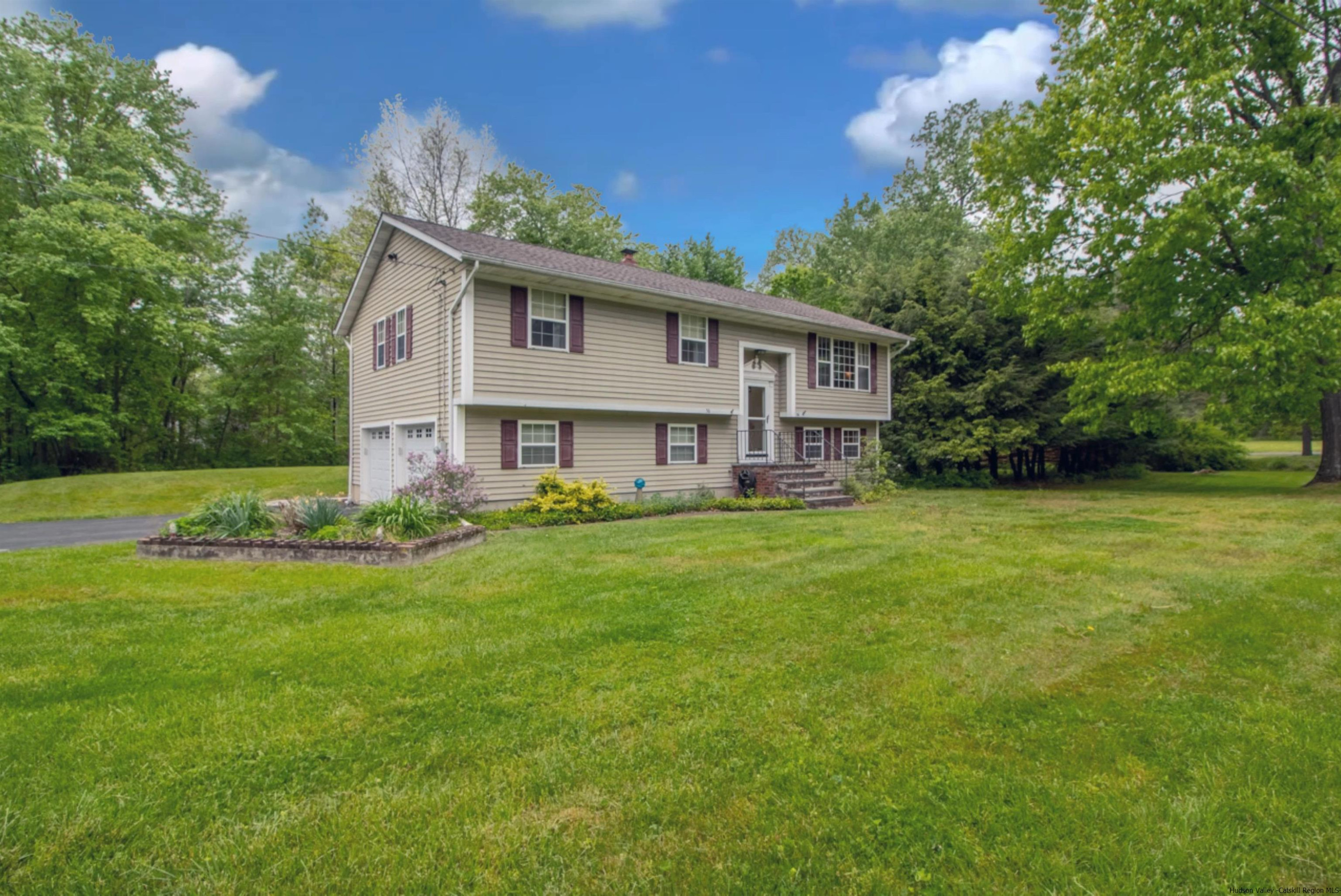 56 Alan Street Stone Ridge, NY 12484 - Photo 1 of 21 a front view of house with yard and green space