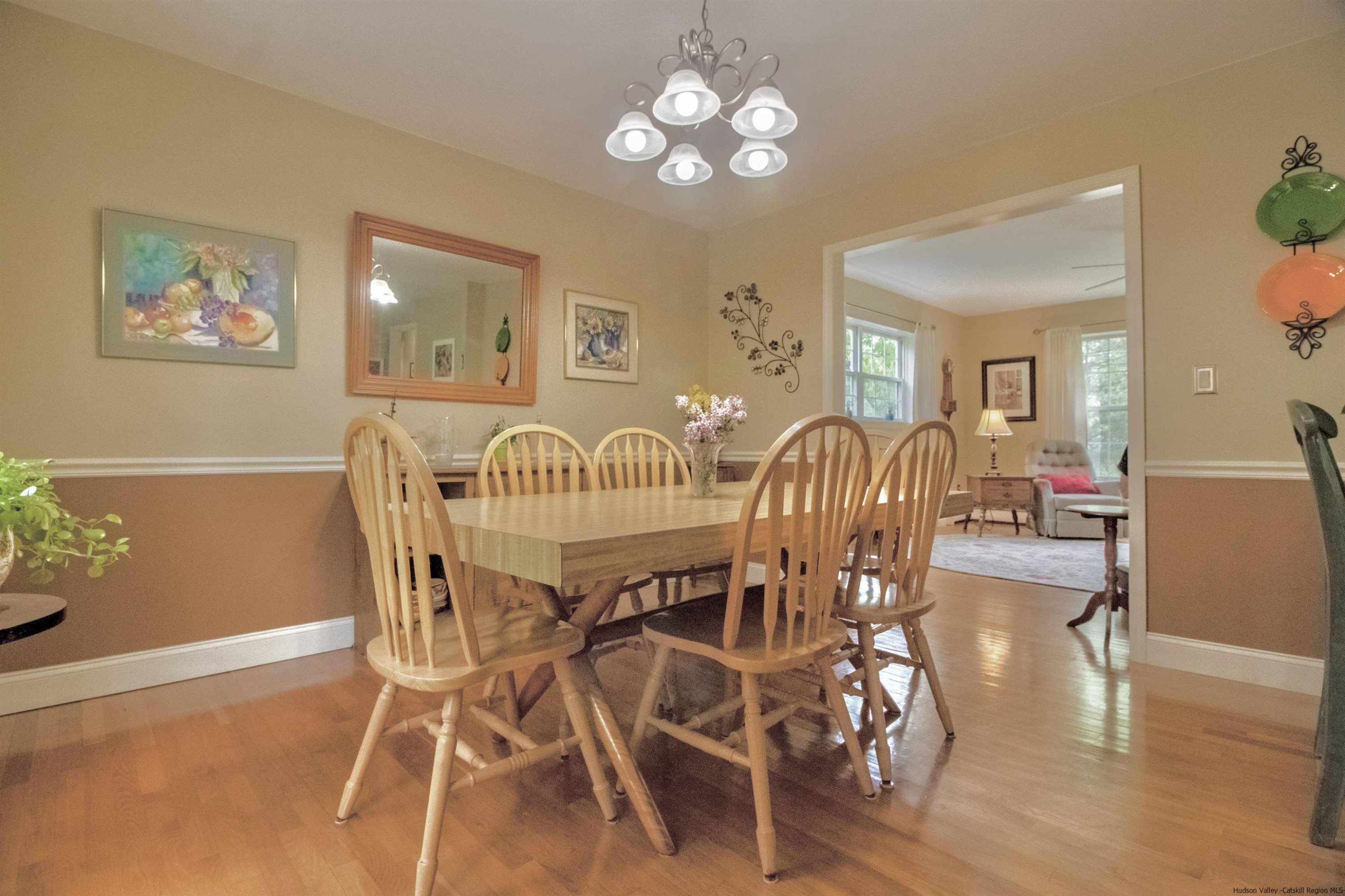 56 Alan Street Stone Ridge, NY 12484 - Photo 5 of 21 a view of a dining room with furniture and wooden floor