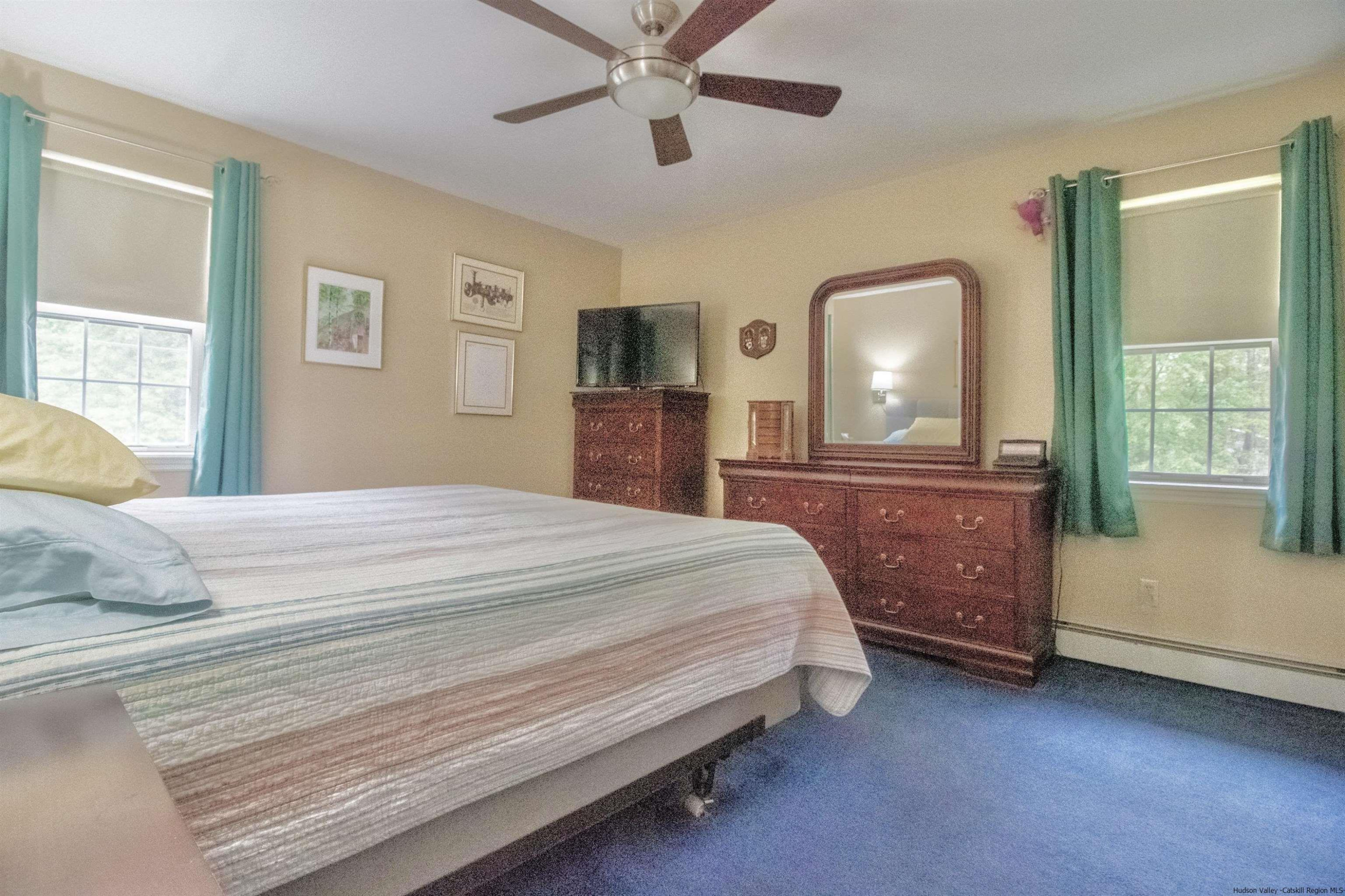 56 Alan Street Stone Ridge, NY 12484 - Photo 9 of 21 a bedroom with a bed and a dresser