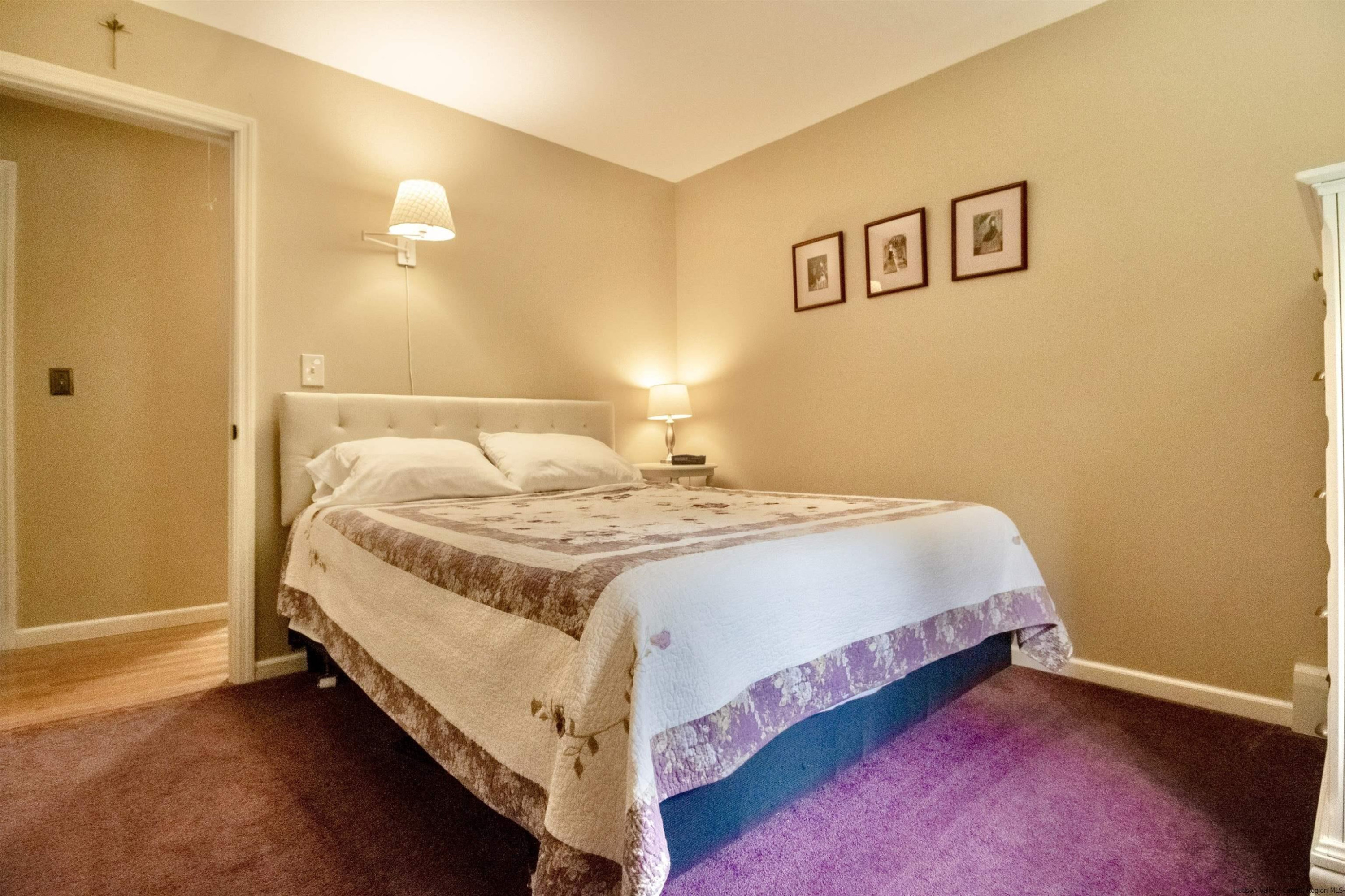 56 Alan Street Stone Ridge, NY 12484 - Photo 10 of 21 a bedroom with a bed and painting on the wall