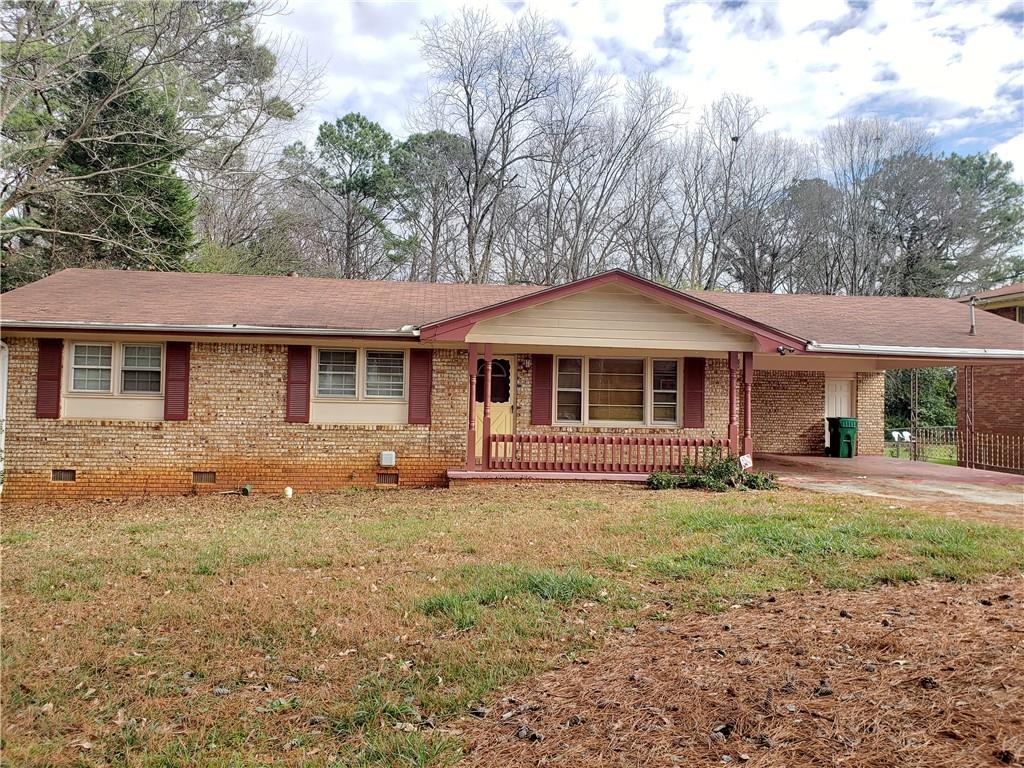 1476 Thompson Place Decatur, GA 30032 - Photo 1 of 1 a front view of a house with a garden