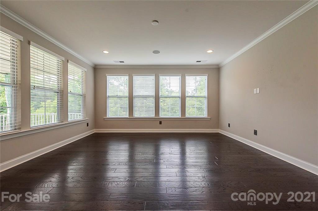 1021 Emory Lane Fort Mill, SC 29708 - Photo 11 of 24 an empty room with wooden floor and windows