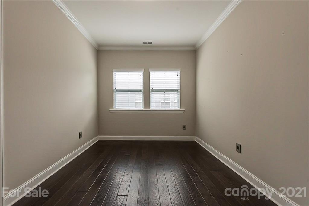 1021 Emory Lane Fort Mill, SC 29708 - Photo 13 of 24 an empty room with wooden floor and windows