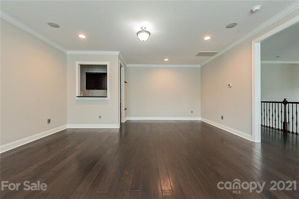 1021 Emory Lane Fort Mill, SC 29708 - Photo 15 of 24 an empty room with wooden floor and windows