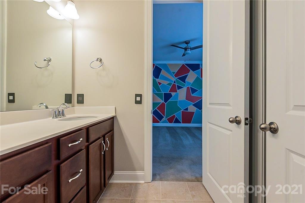 1021 Emory Lane Fort Mill, SC 29708 - Photo 19 of 24 a bathroom with a sink and a mirror