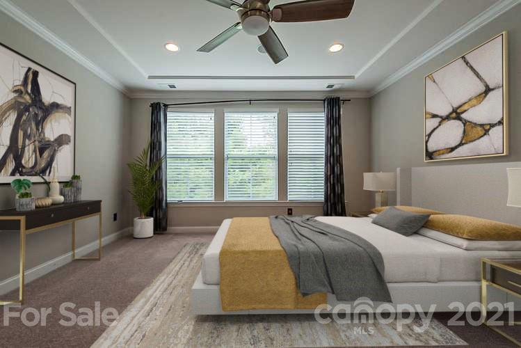 1021 Emory Lane Fort Mill, SC 29708 - Photo 3 of 24 a bedroom with a bed and glass windows