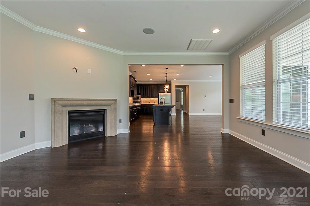 1021 Emory Lane Fort Mill, SC 29708 - Photo 5 of 24 a view of a livingroom with furniture wooden floor fireplace and windows