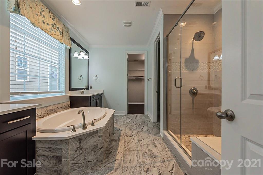 1021 Emory Lane Fort Mill, SC 29708 - Photo 6 of 24 a bathroom with a tub and a shower