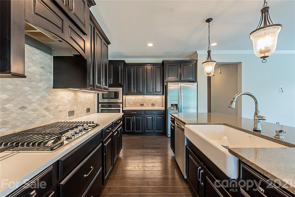 1021 Emory Lane Fort Mill, SC 29708 - Photo 8 of 24 a kitchen with a stove and a sink