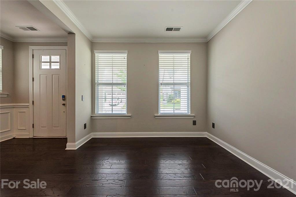 1021 Emory Lane Fort Mill, SC 29708 - Photo 9 of 24 an empty room with wooden floor and windows