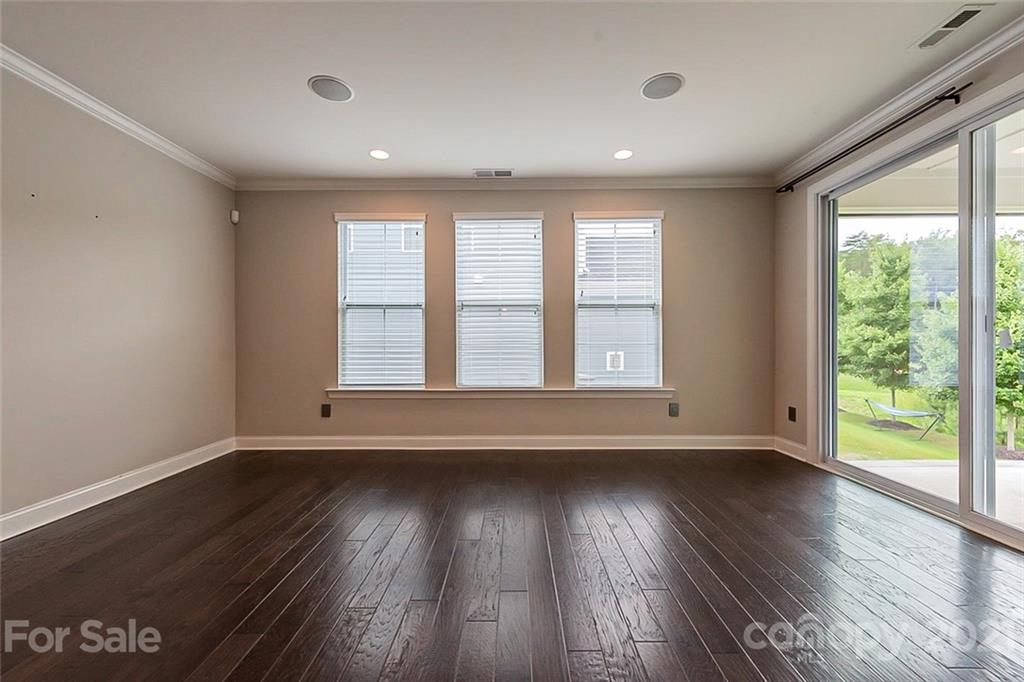1021 Emory Lane Fort Mill, SC 29708 - Photo 10 of 24 a view of an empty room with wooden floor and a window