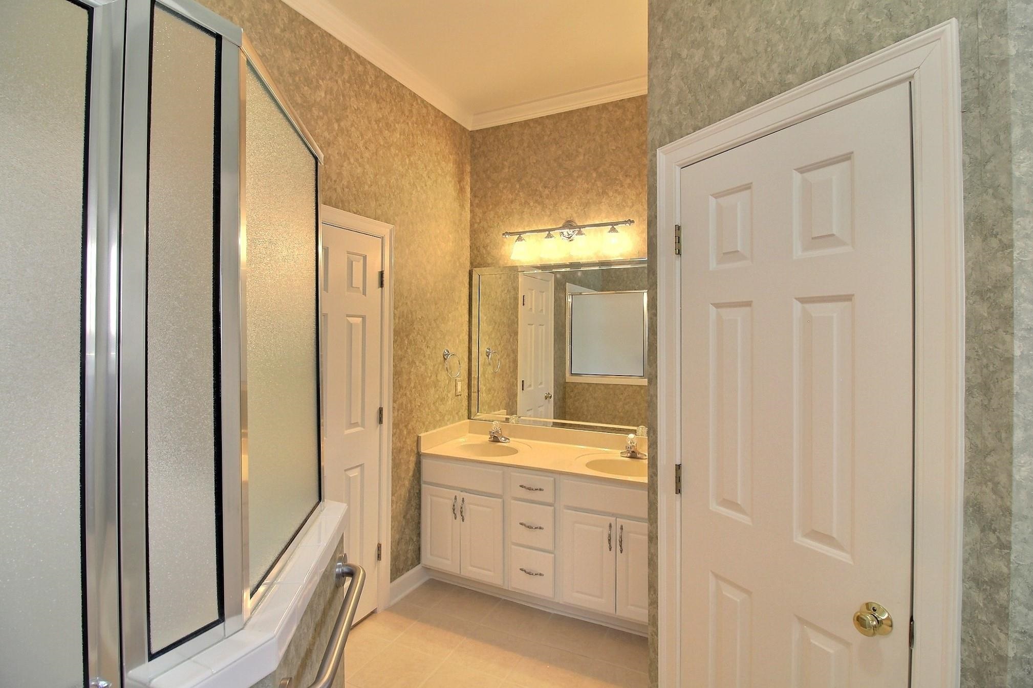 1748 Higginson Square Collierville, TN 38017 - Photo 14 of 23 a spacious bathroom with a shower and a sink