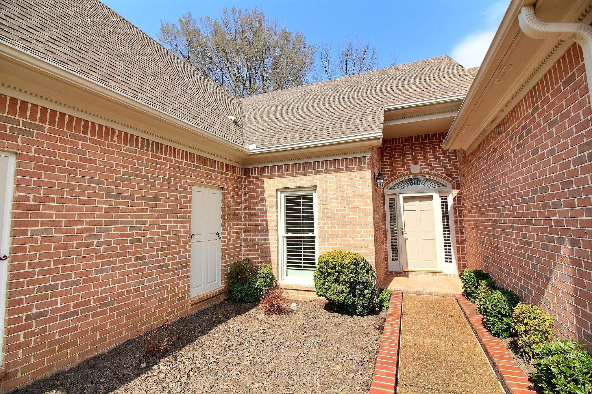 1748 Higginson Square Collierville, TN 38017 - Photo 4 of 23 a view of a house with a backyard