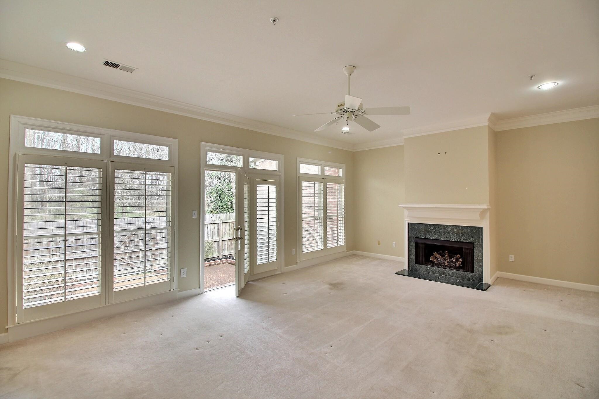 1748 Higginson Square Collierville, TN 38017 - Photo 10 of 23 a view of an empty room with window and fire place