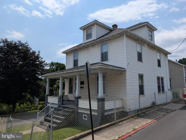 a view of house with a patio