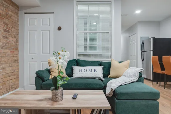 a view of a bedroom with furniture and window