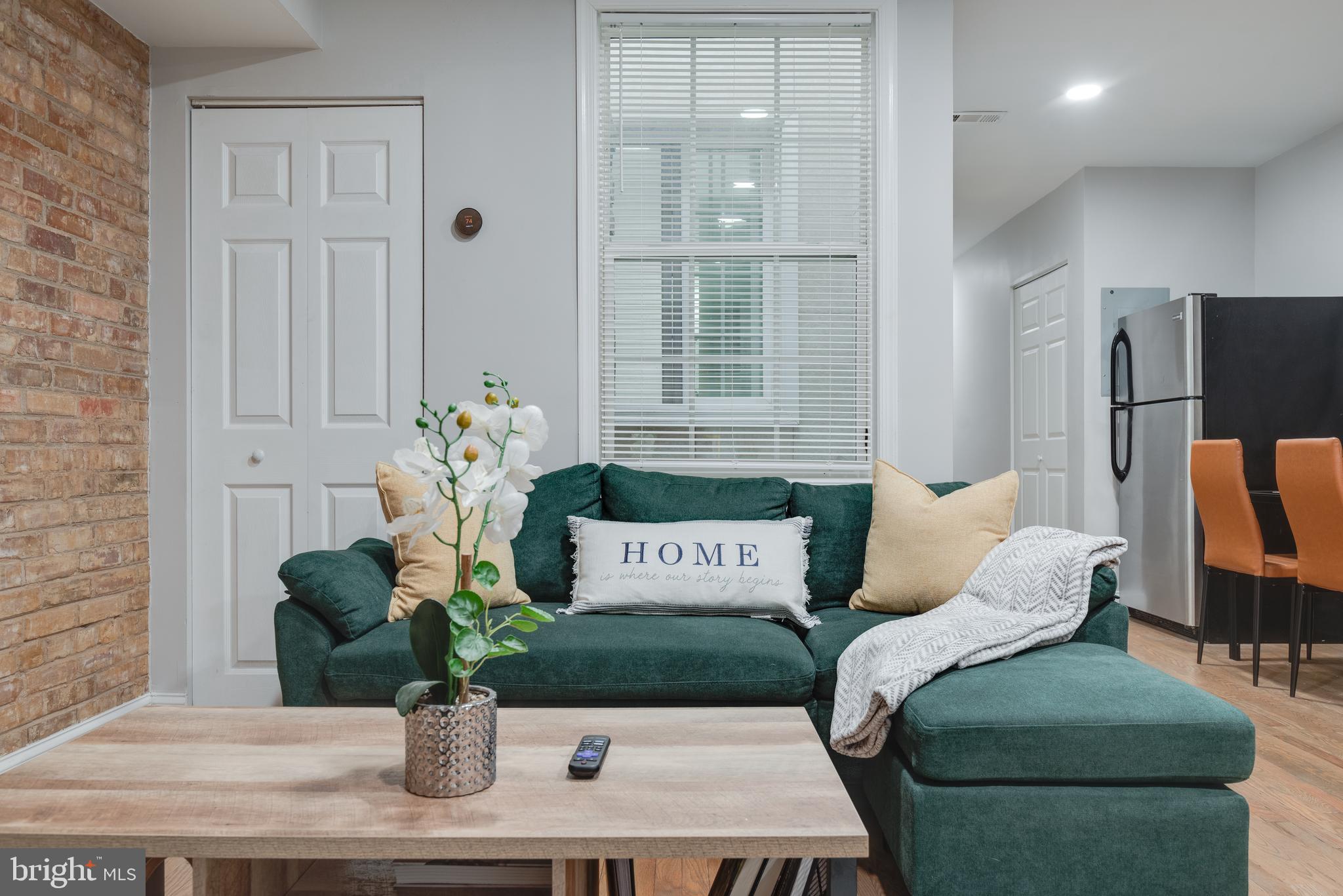 a view of a bedroom with furniture and window