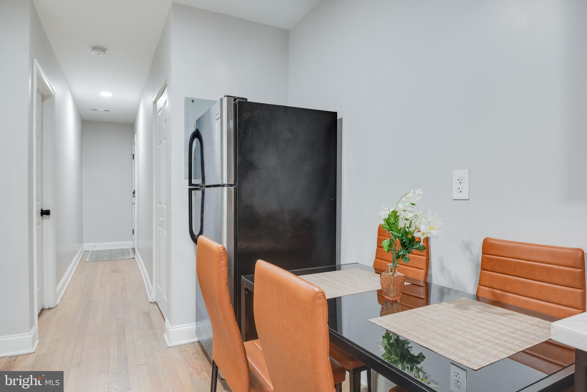 1255 Raum Street Northeast, Unit 1 Washington, DC 20002 - Photo 12 of 31 a living room with furniture and a potted plant