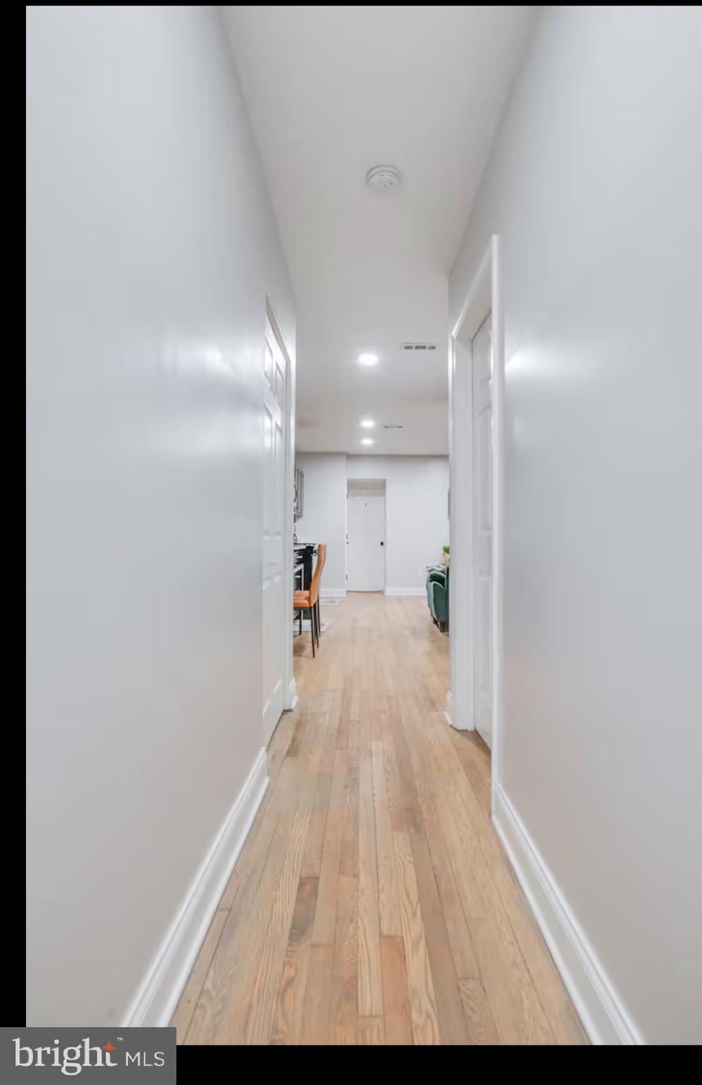 1255 Raum Street Northeast, Unit 1 Washington, DC 20002 - Photo 16 of 16 a view of a hallway with wooden floor