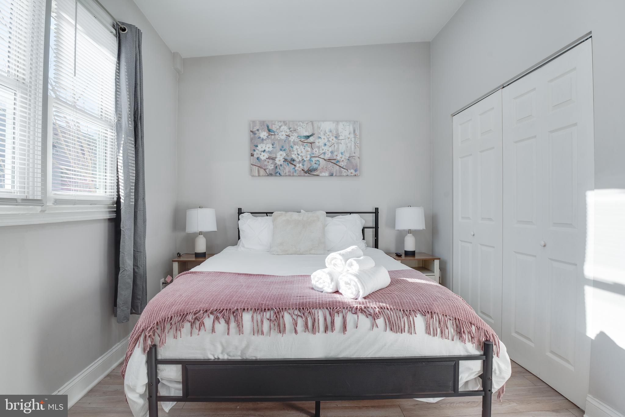 1255 Raum Street Northeast, Unit 1 Washington, DC 20002 - Photo 20 of 31 a bedroom with a bed and a window