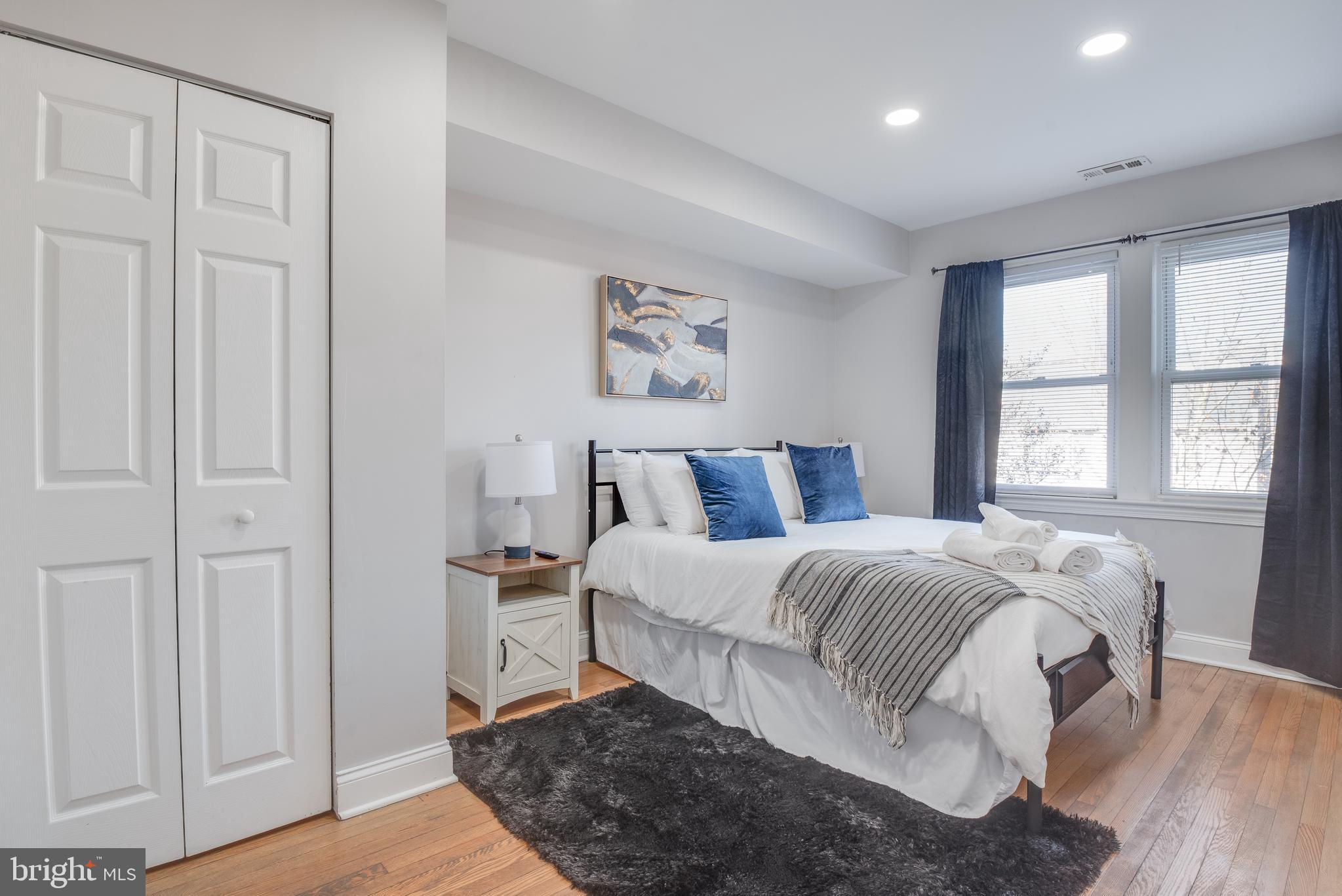 1255 Raum Street Northeast, Unit 1 Washington, DC 20002 - Photo 25 of 31 a bedroom with a bed and a window