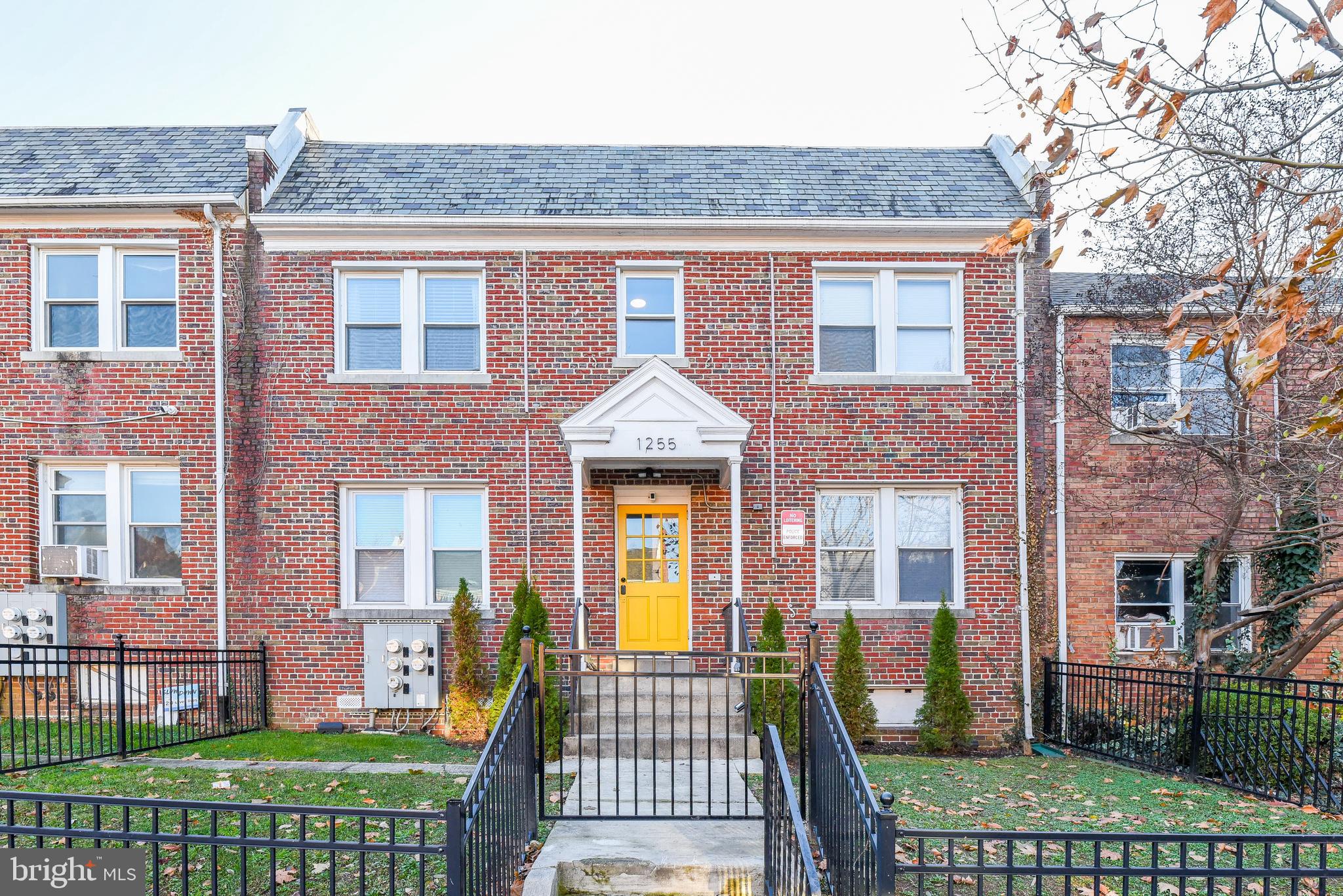 1255 Raum Street Northeast, Unit 1 Washington, DC 20002 - Photo 31 of 31 a front view of a house with a garden