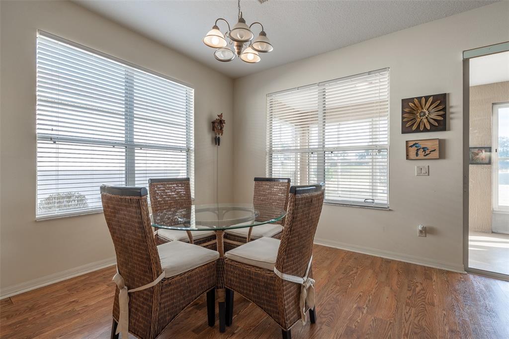 15803 Southwest 11th Court Road Ocala, FL 34473 - Photo 11 of 59 a view of a dining room with furniture window and wooden floor