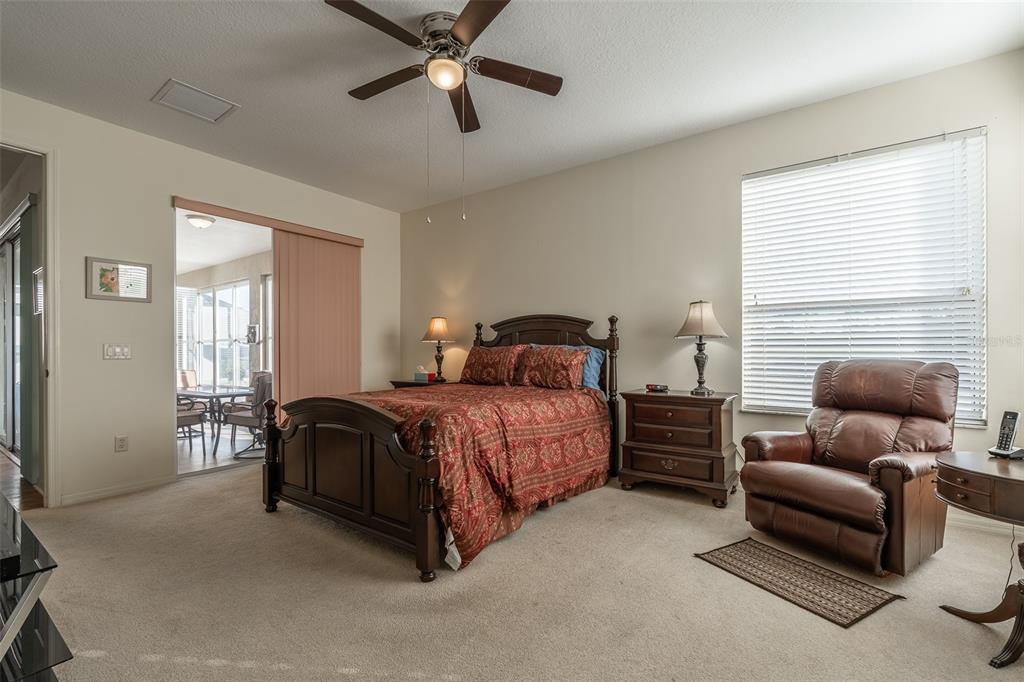 15803 Southwest 11th Court Road Ocala, FL 34473 - Photo 22 of 59 a bedroom with a bed couch and window