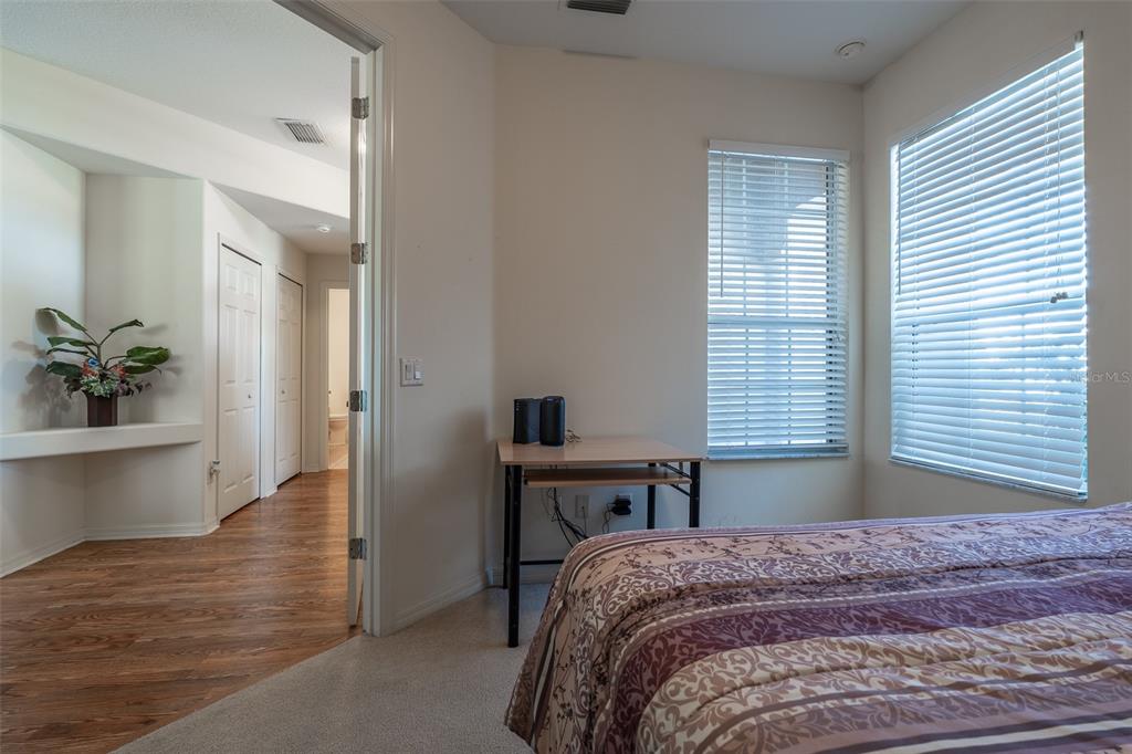 15803 Southwest 11th Court Road Ocala, FL 34473 - Photo 30 of 59 a bedroom with a bed and a table