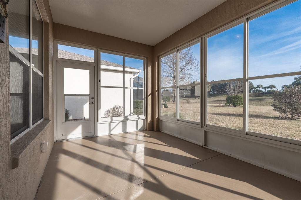 15803 Southwest 11th Court Road Ocala, FL 34473 - Photo 42 of 59 a room with large windows and furniture