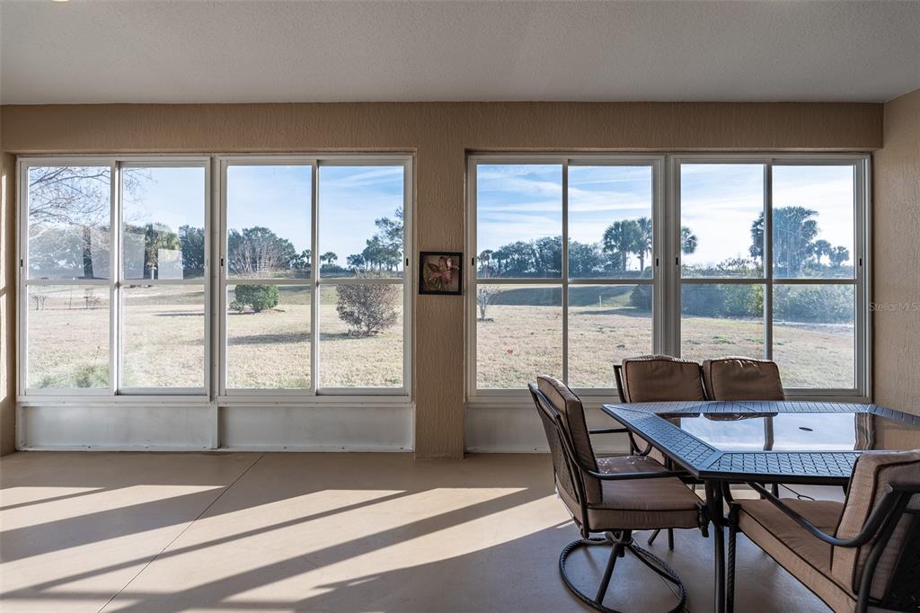 15803 Southwest 11th Court Road Ocala, FL 34473 - Photo 43 of 59 a dining room with furniture window and outside view